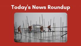 State Disaster Response Force (SDRF) personnel cross the River Brahmaputra through a bamboo bridge on a cold and foggy morning, in Guwahati, on Dec. 27, 2022