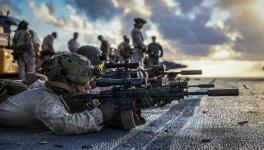 US Marines conduct live-fire training on the flight deck of USS Iwo Jima (LHD 7) in the Caribbean Sea as part of the SOUTHCOM's deployment. Photo: US Marines / X