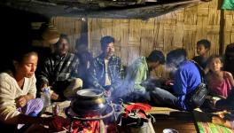 Residents feeling the warmth of the fire on a cold winter night (Photo - Sayantani Deb, 101Reporters)