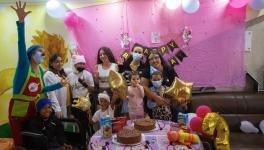 Lis, her family, children in the ward, and clowns, celebrating her birthday. Photo: Naturaleza Secreta