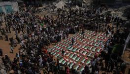 Bodies of members of the Hassayna and Abu Sharia families, killed in an Israeli strike in 2023 and recently recovered from the rubble, are draped in Palestinian flags during their funeral in Gaza City, Tuesday, Aug. 4, 2026. Photo: AP