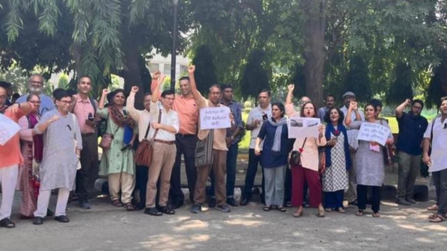 A group of people holding signs Description automatically generated AUDFA’s protest demonstration at Karampura Campus of AUD, on 5th September.