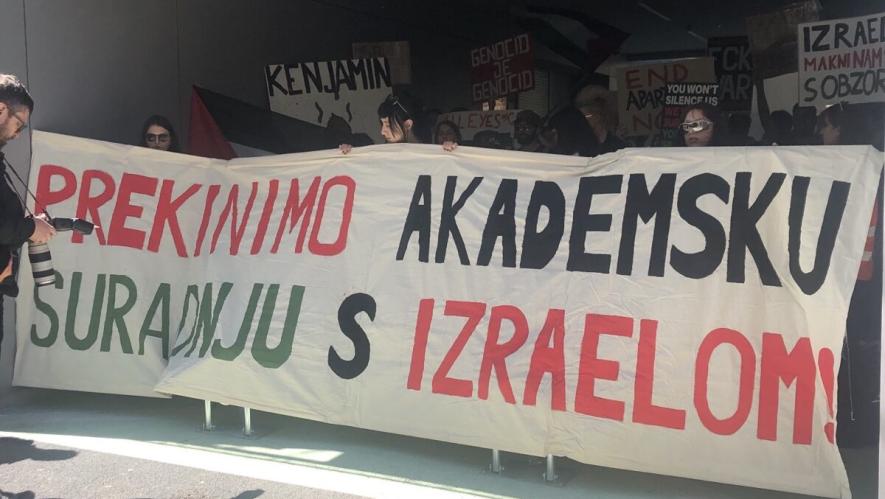 Students holding banner: "End academic cooperation with Israel". Source: Peoples Dispatch