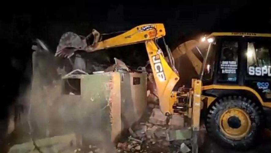 Bulldozer action at Dum Dum station area.